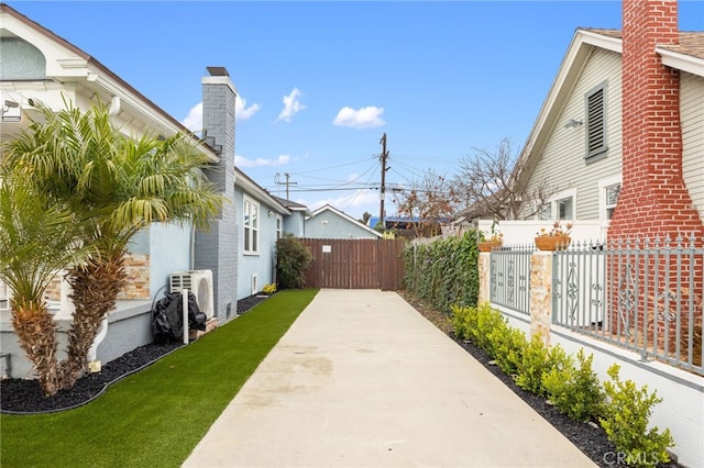 view of home's exterior with a patio and a yard