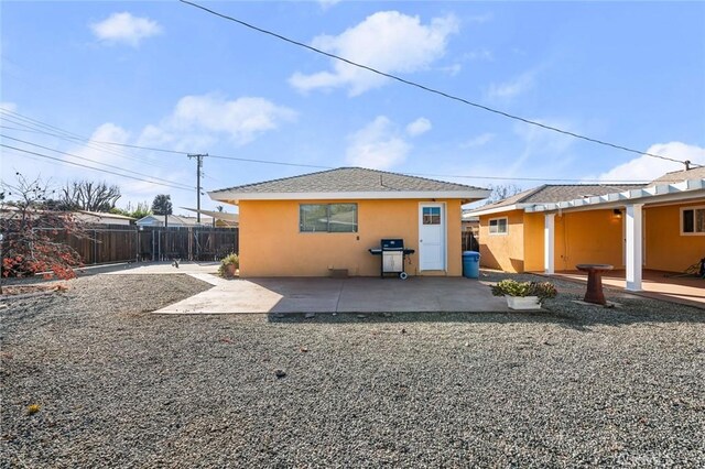 back of property featuring a patio area