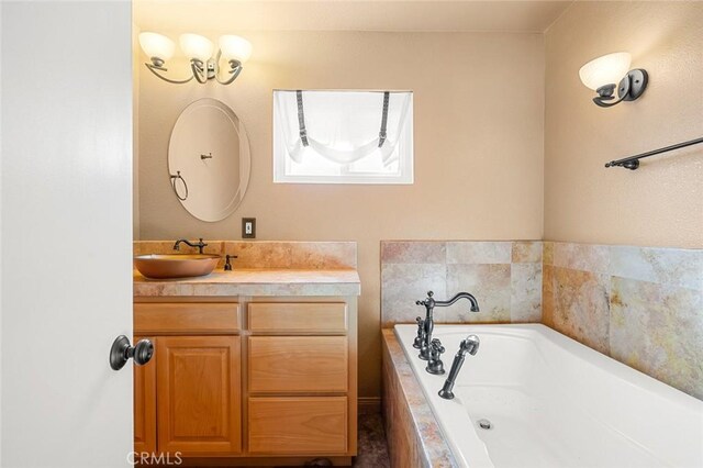 bathroom featuring vanity and a relaxing tiled tub