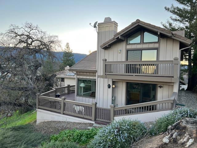 rear view of house featuring a balcony