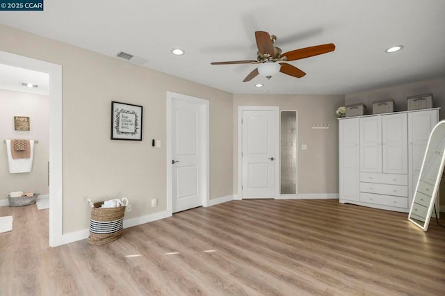 unfurnished bedroom featuring ceiling fan and light wood-type flooring