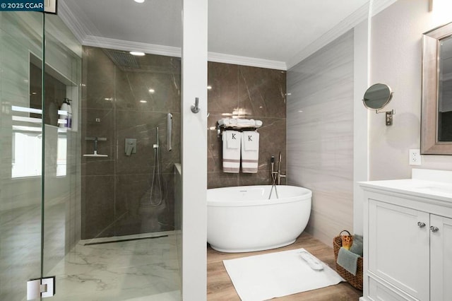 bathroom featuring crown molding, vanity, shower with separate bathtub, and tile walls