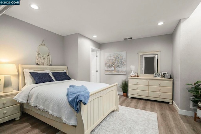 bedroom featuring hardwood / wood-style floors