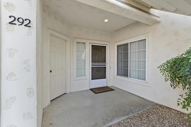 doorway to property featuring a patio