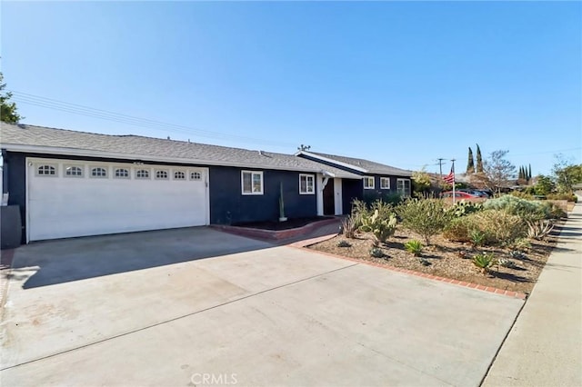 ranch-style home featuring a garage