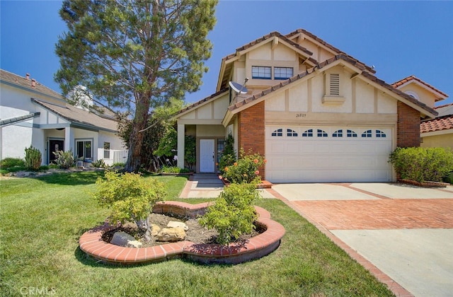 tudor-style house with a garage and a front lawn