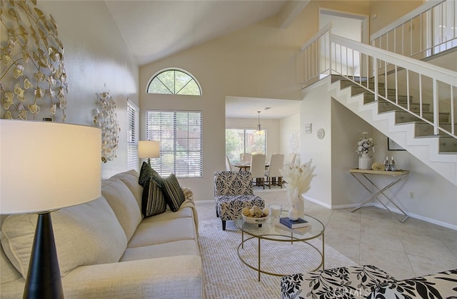 tiled living room featuring high vaulted ceiling