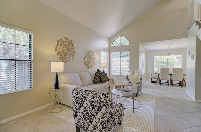 tiled living room featuring high vaulted ceiling