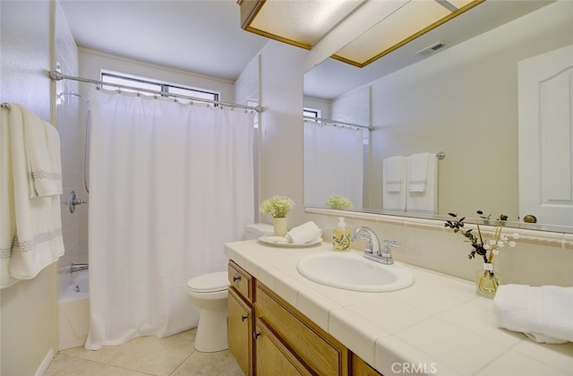 full bathroom with toilet, vanity, shower / bath combo, and tile patterned flooring