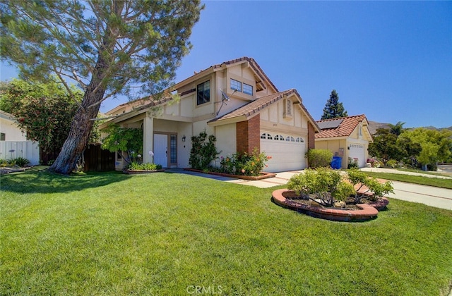 view of front of property featuring a front lawn and a garage