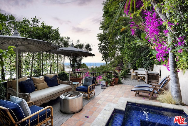 patio terrace at dusk with an outdoor hangout area