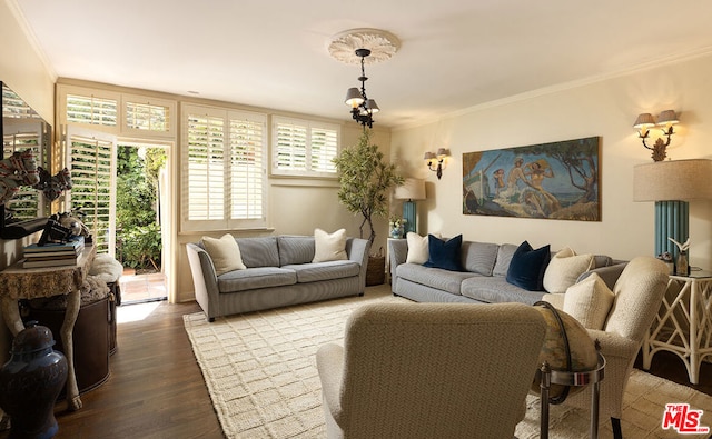 living room with wood-type flooring and ornamental molding