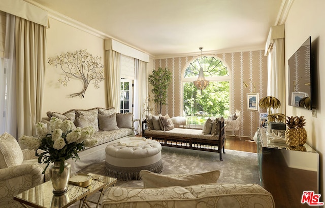 sitting room featuring wood-type flooring and crown molding