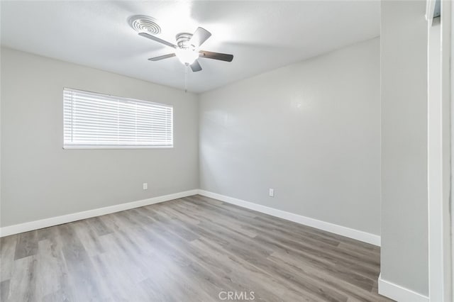 empty room featuring light hardwood / wood-style floors and ceiling fan