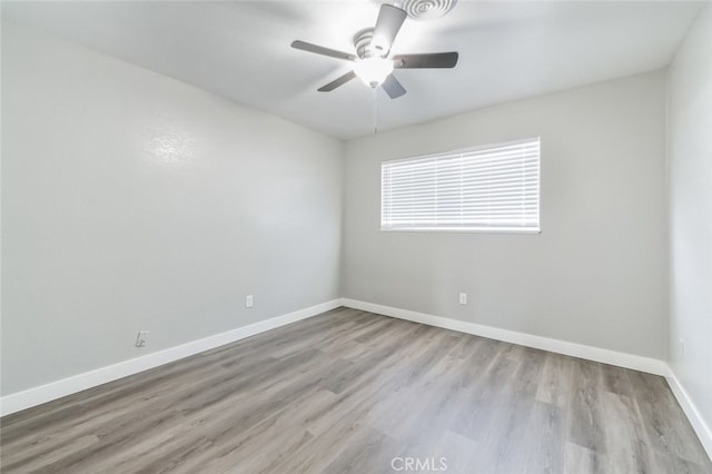 unfurnished room featuring ceiling fan and light hardwood / wood-style flooring