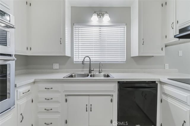 kitchen featuring sink, white cabinetry, black appliances, and extractor fan