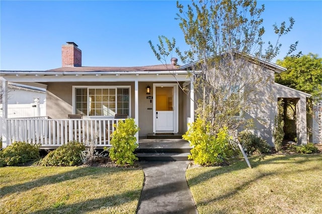 bungalow-style house featuring a porch and a front lawn