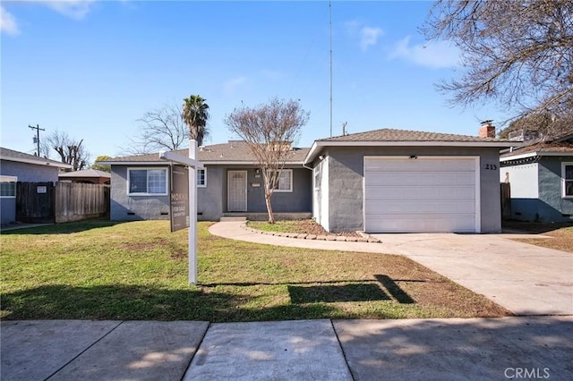 ranch-style house featuring a garage and a front lawn