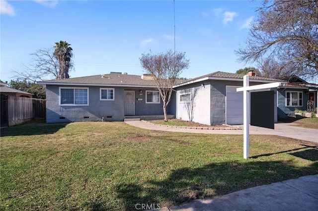 ranch-style house with a garage and a front yard