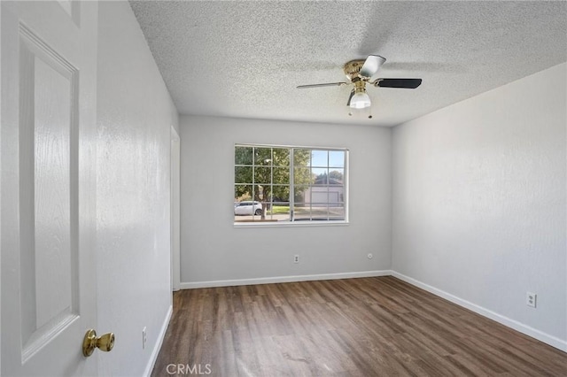 spare room with ceiling fan, hardwood / wood-style floors, and a textured ceiling