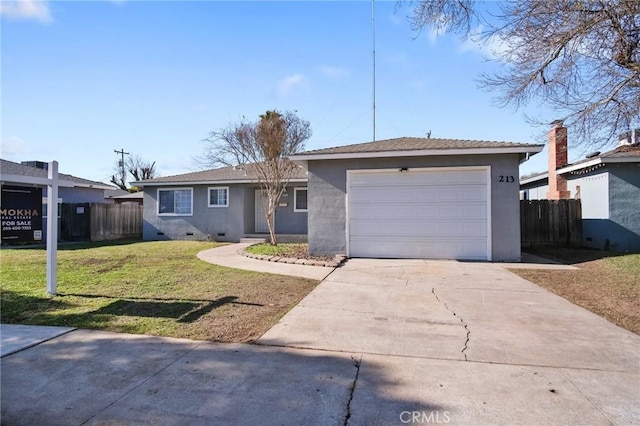 single story home featuring a garage and a front lawn