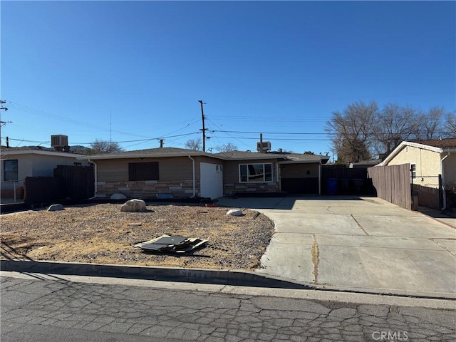 single story home featuring central AC unit