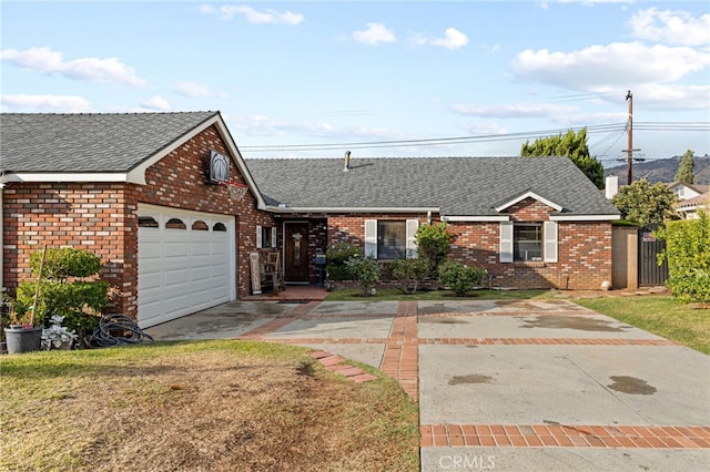 single story home featuring a front yard and a garage