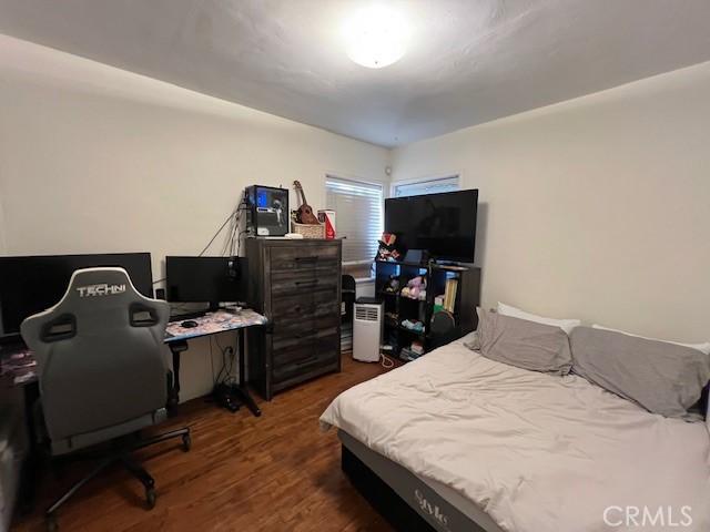 bedroom featuring dark hardwood / wood-style flooring