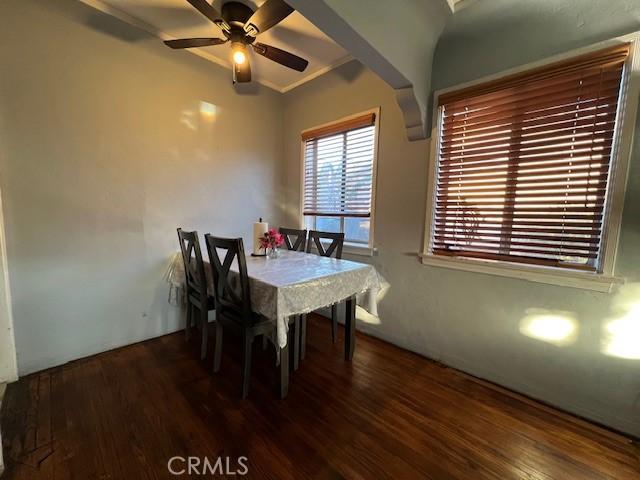 dining room featuring dark wood-type flooring and ceiling fan