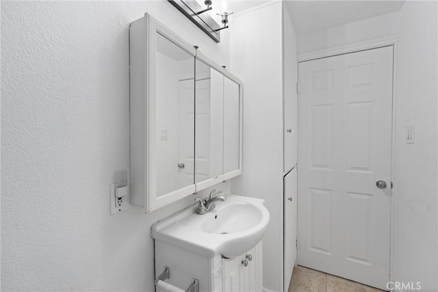 bathroom featuring a sink and tile patterned floors