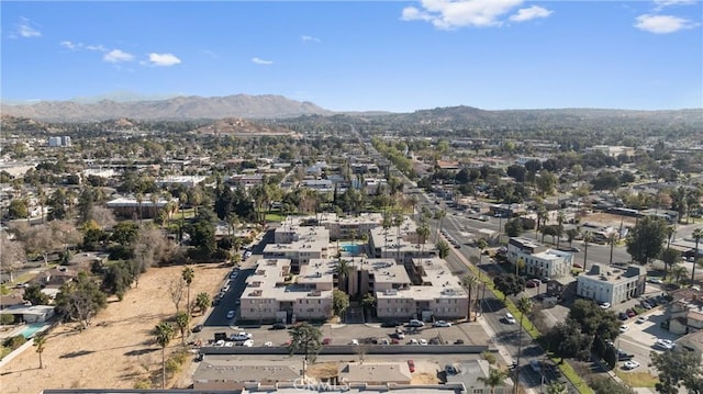 birds eye view of property with a mountain view