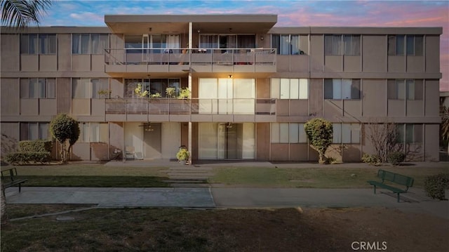 view of outdoor building at dusk