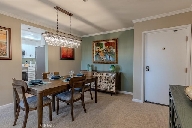 carpeted dining area with crown molding and a chandelier