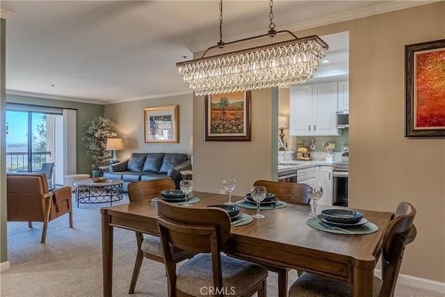 dining space featuring crown molding, an inviting chandelier, and light carpet