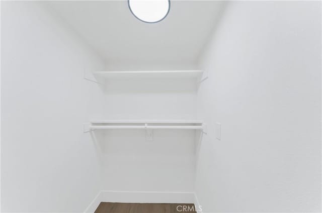 walk in closet featuring hardwood / wood-style floors