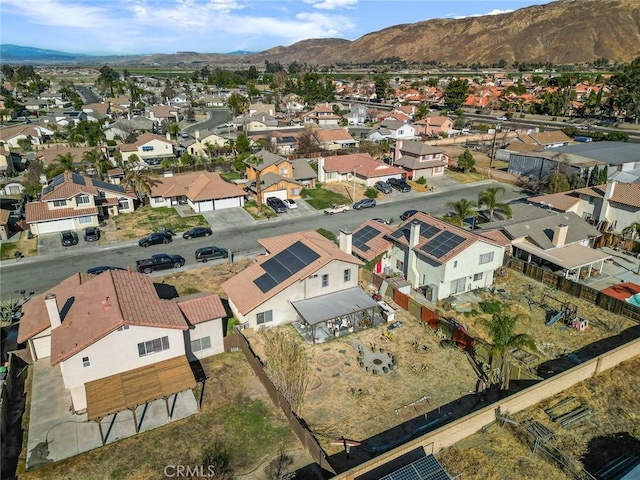 birds eye view of property with a residential view and a mountain view