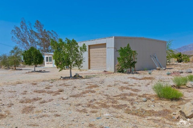 view of outbuilding featuring a garage