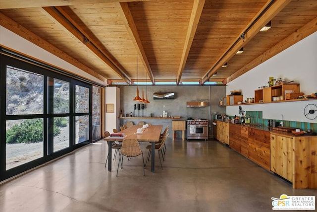 dining space featuring beam ceiling and wood ceiling