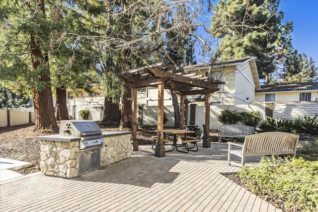 view of patio / terrace featuring an outdoor kitchen, grilling area, and a pergola