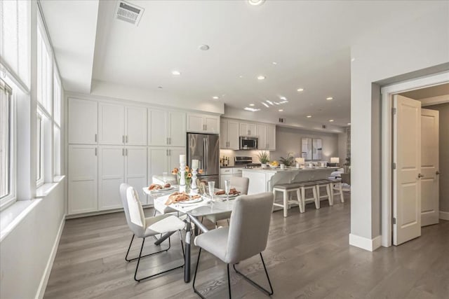 dining area with dark wood-type flooring