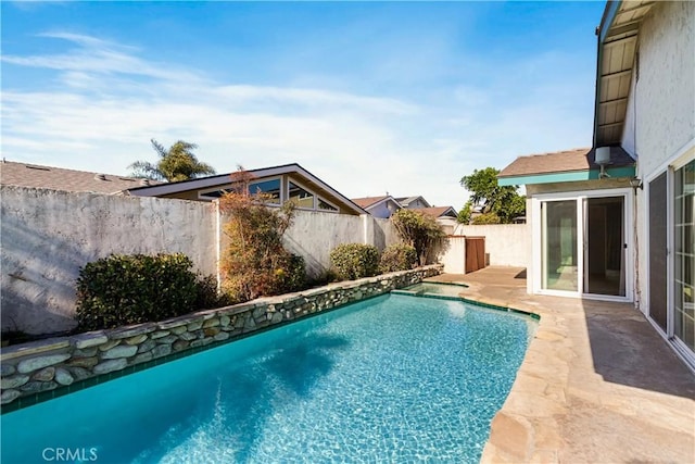 view of swimming pool featuring a fenced in pool, a patio area, and a fenced backyard