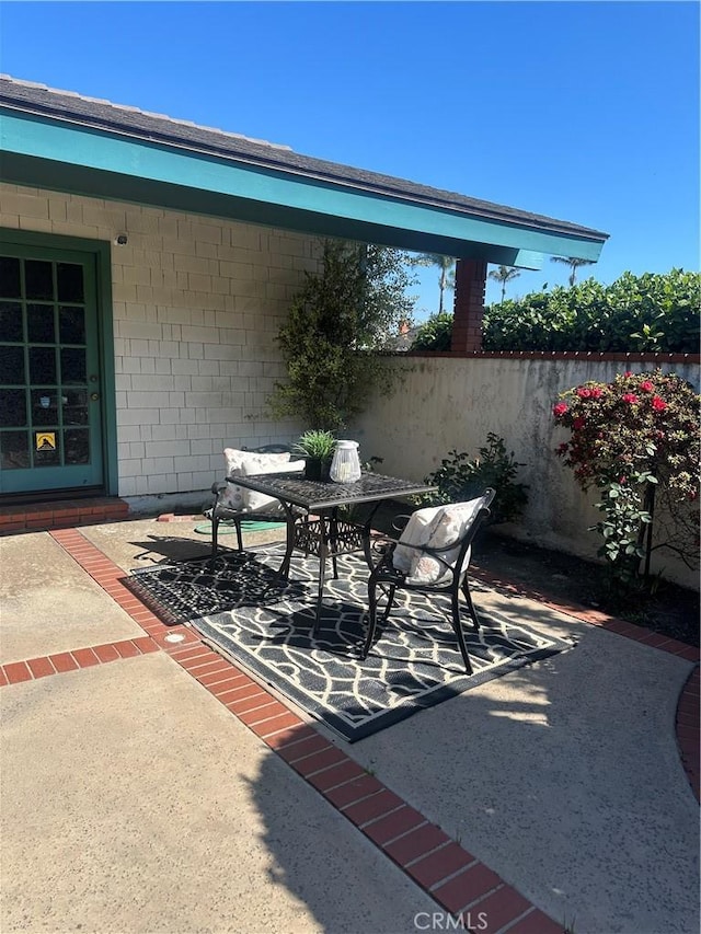 view of patio / terrace featuring fence