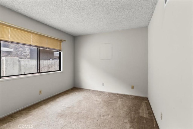 3521 Fern Cir, Seal Beach, CA 90740 - carpeted empty room with a textured ceiling