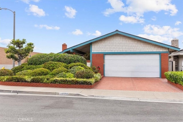 3521 Fern Cir, Seal Beach, CA 90740 - view of front facade featuring a chimney and brick siding