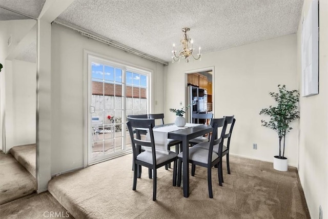 3521 Fern Cir, Seal Beach, CA 90740 - dining area featuring carpet floors, a chandelier, and a textured ceiling
