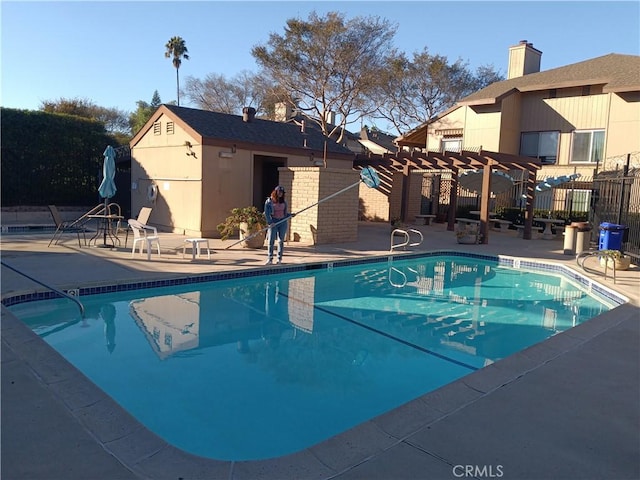 view of pool featuring a pergola and a patio