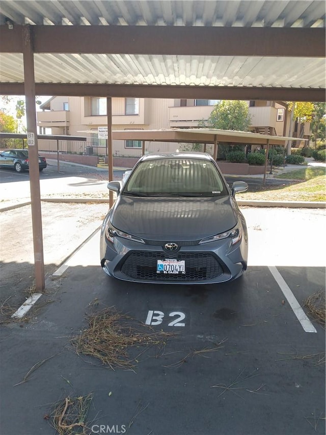 view of parking featuring a carport