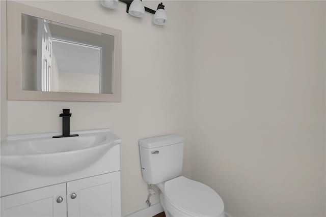 bathroom with toilet and vanity