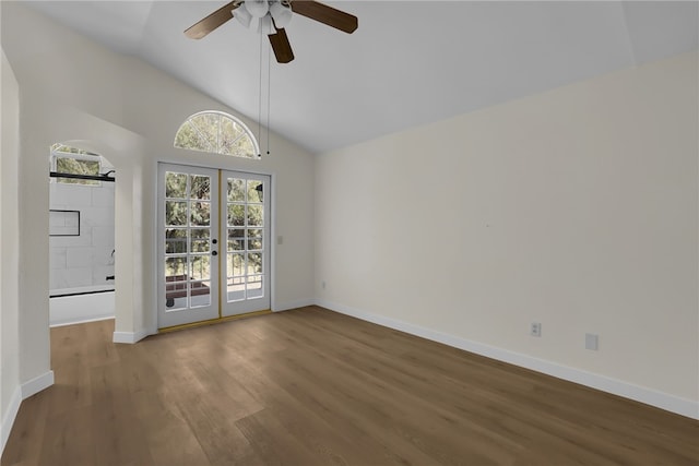 unfurnished room with hardwood / wood-style flooring, high vaulted ceiling, french doors, and ceiling fan