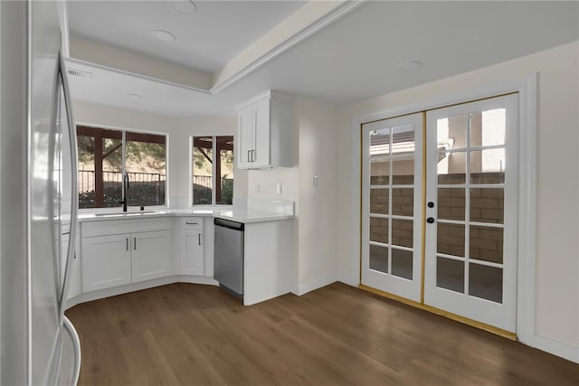 kitchen with stainless steel appliances, french doors, white cabinets, and sink